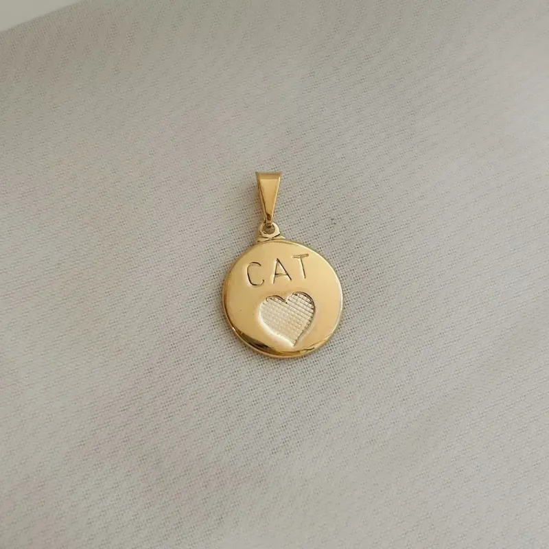 PINGENTE MEDALHA CAT. BANHADO A OURO 18K.