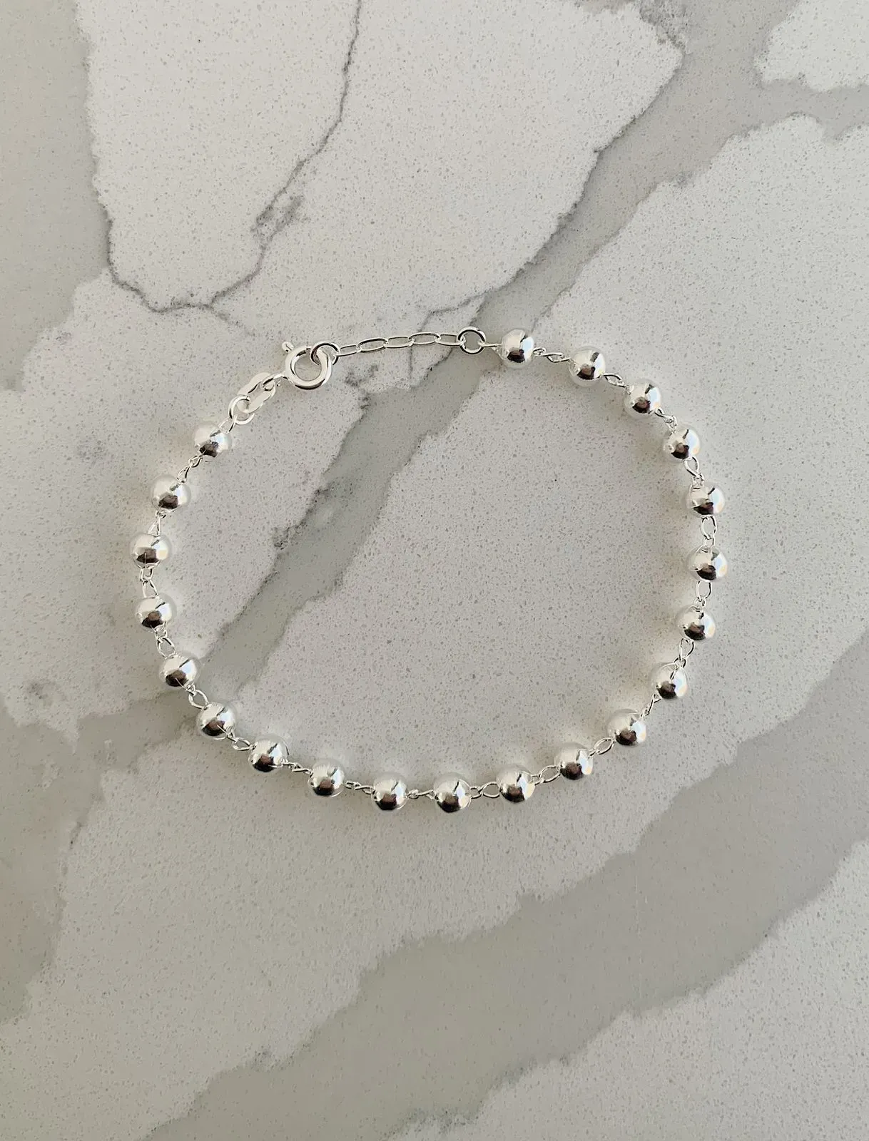 PULSEIRA 21 BOLINHAS. 18CM DE COMPRIMENTO E 2CM DE REGULAGEM. EM PRATA 925.